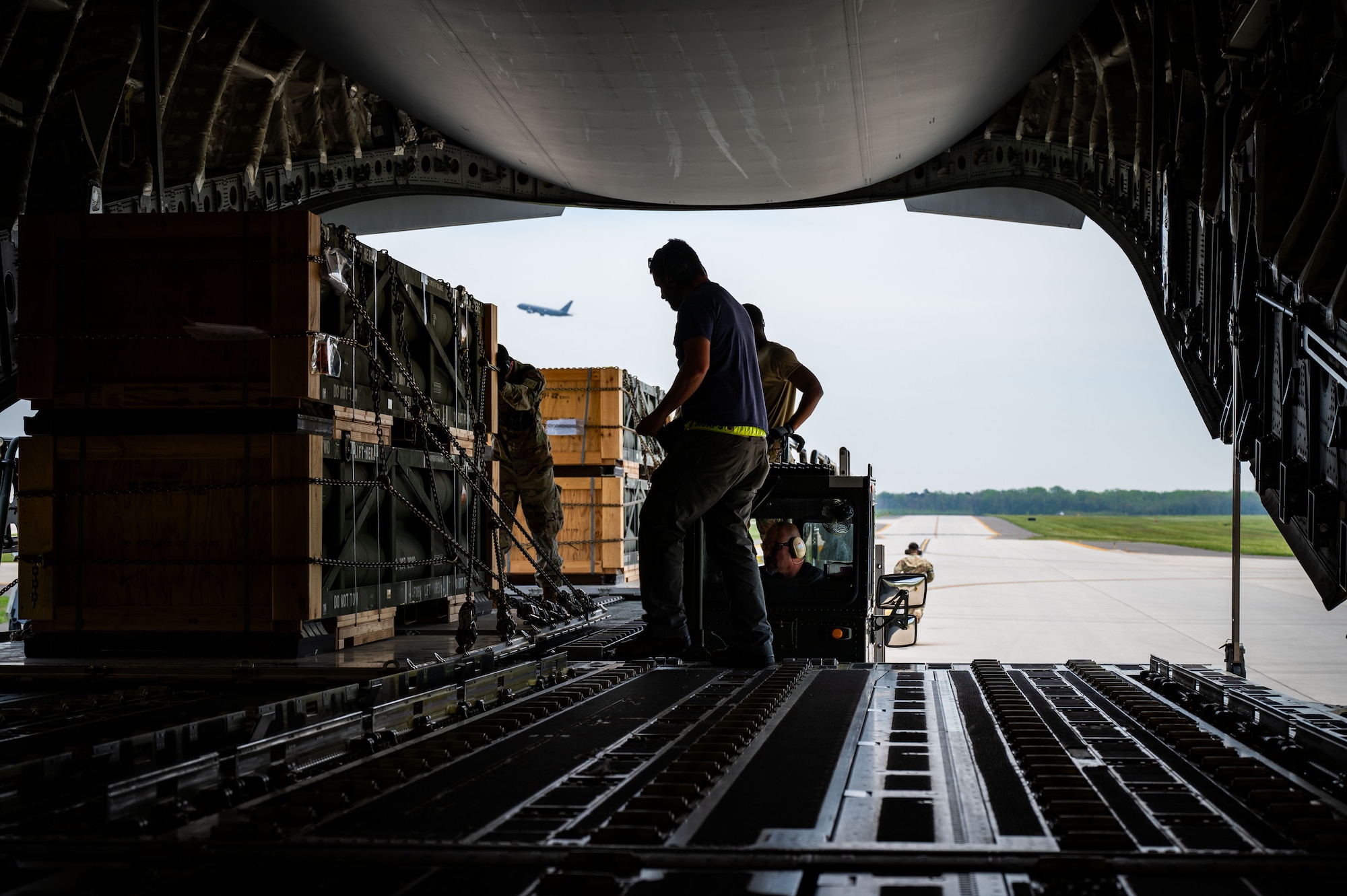 Airmen assigned to the 305th Aerial Port Squadron upload munitions onboard a C-17 Globemaster III at Joint Base McGuire-Dix-Lakehurst, N.J. The munitions cargo is part of an additional security assistance package for Ukraine. The security assistance the U.S. is providing to Ukraine is enabling critical success on the battlefield against the Russian invading force. (U.S. Air Force photo by 2nd Lt. Alexis Kula)