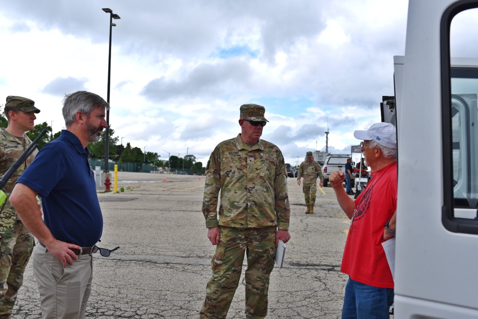 Brig. Gen. Matthew Beilfuss and WEM Administrator Greg Engle speak to an amateur radio participant in the 2024 SIMCOM exercise. Photo by: WI DMA Staff