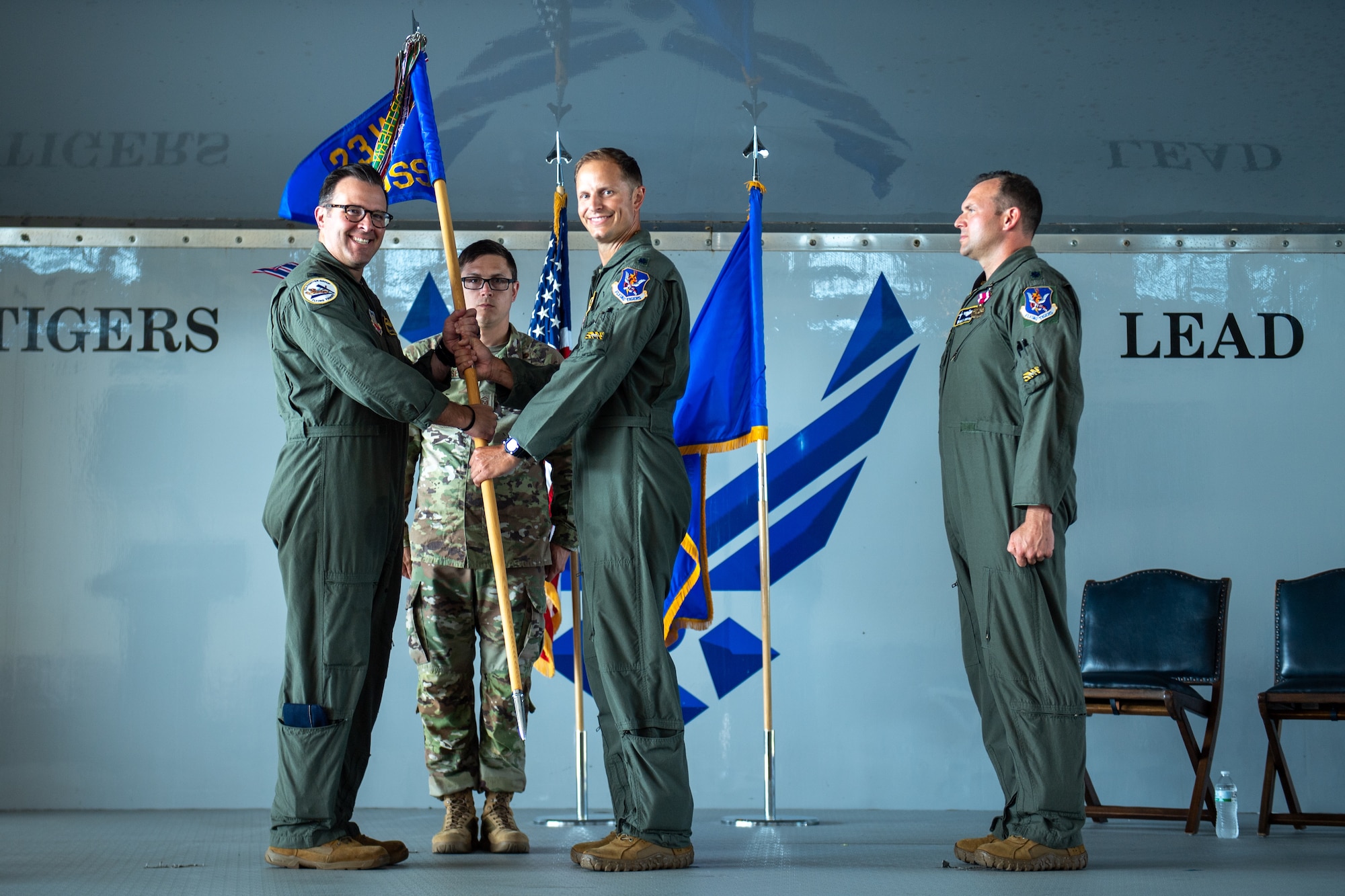 this is a photo of the passing of a guidon during a change of command
