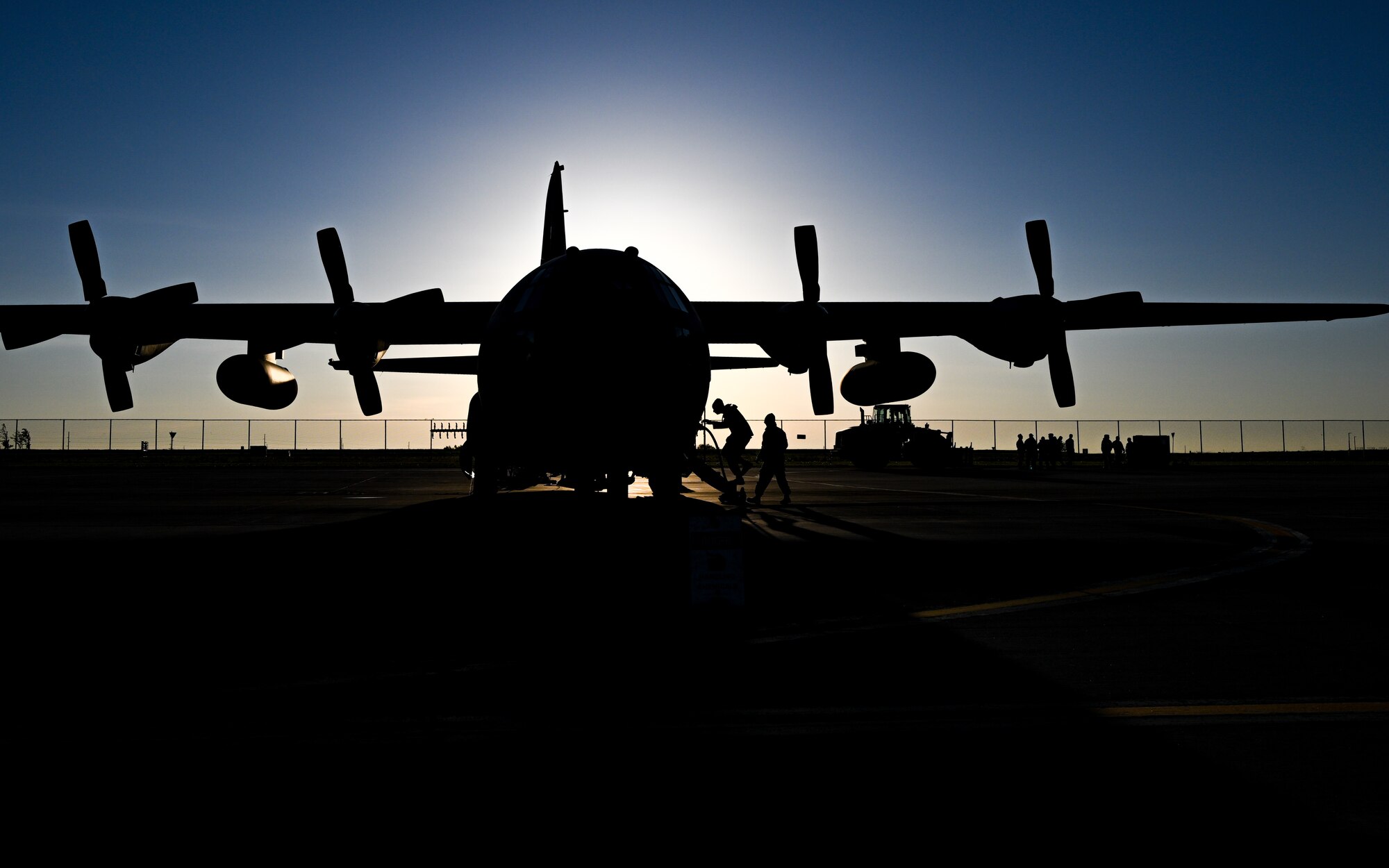 U.S. Airmen assigned to the 910th Aircraft Maintenance Squadron board a 910th Airlift Wing aerial spray-modified C-130H Hercules aircraft, on May 29, 2024, to conduct preflight checks at Williston Basin International Airport, North Dakota.