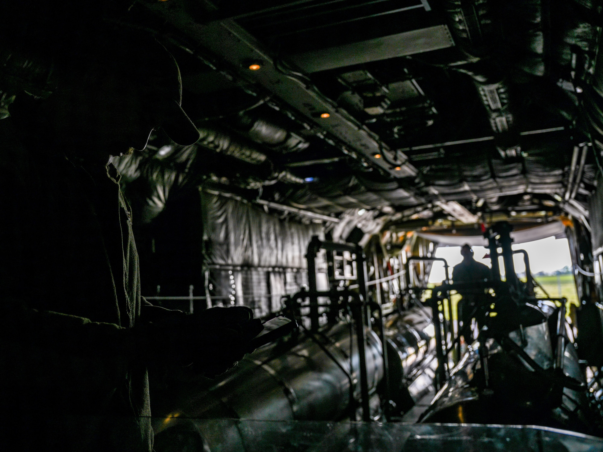 U.S. aerial spray qualified loadmasters assigned to the 757thAirlift Squadron conduct preflight checks on a 910th Airlift Wing Modular Aerial Spray System, May 29, 2024, onboard an aerial spray modified C-130H Hercules aircraft parked at Williston Basin International Airport, North Dakota.