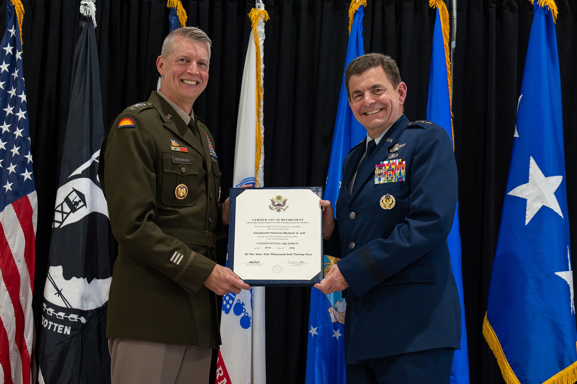 U.S. Army General Daniel R. Hokanson, left, chief, National Guard Bureau, and U.S. Air Force Lt. Gen. Michael A. Loh, director, Air National Guard (ANG), pose for a portrait.