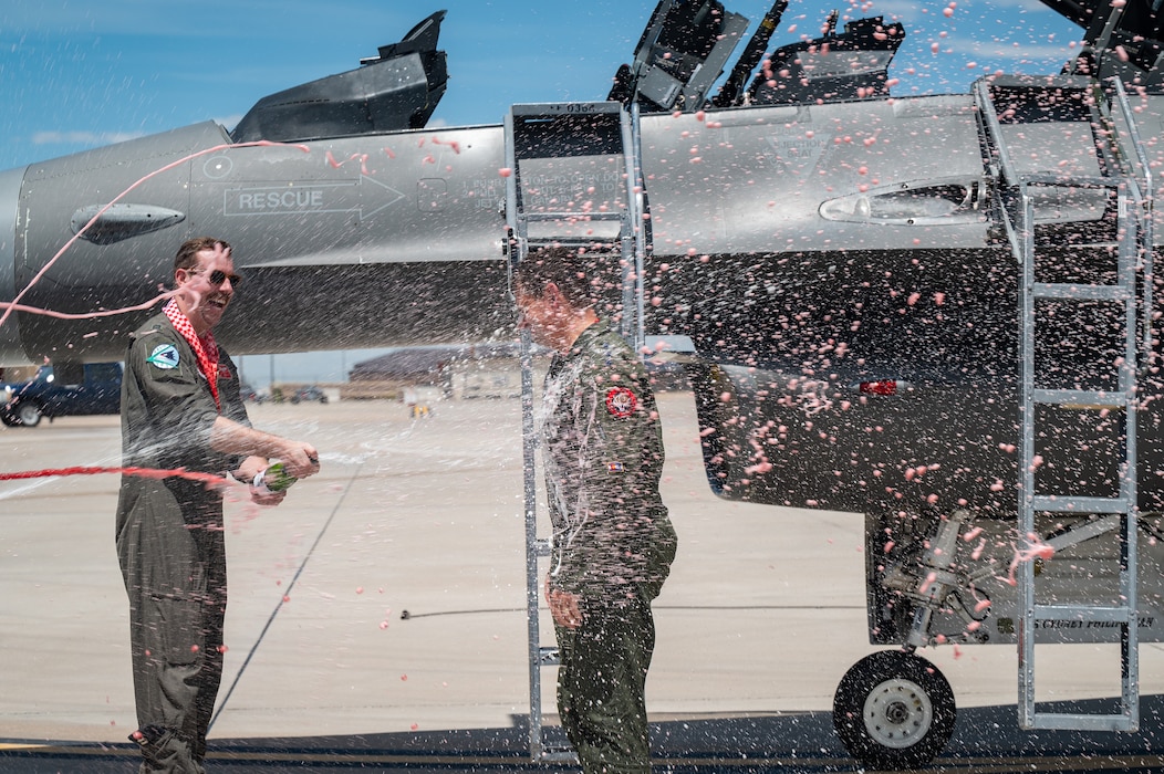U.S. Air Force Lt. Gen. Michael A. Loh is soaked by family, friends and loved ones after completing his final flight, or “fini flight,” at Buckley Space Force Base, Aurora, Colorado.