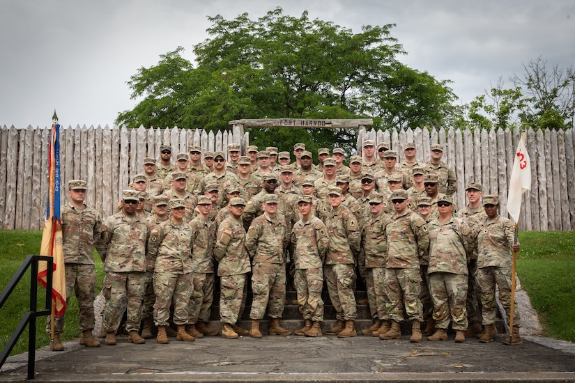 Soldiers with the 103rd Brigade Support Battalion, 138th Field Artillery Brigade, pose for a photo at the Old Fort Harrod State Park in Harrodsburg, Kentucky on June 8, 2024. The 103rd BSB supported the 250th anniversary of the settlement of Harrodsburg by participating in posting the colors, marching in the parade, and providing a static display of military vehicles. (U.S. Army National Guard photo by Sgt. 1st Class Andrew Dickson)