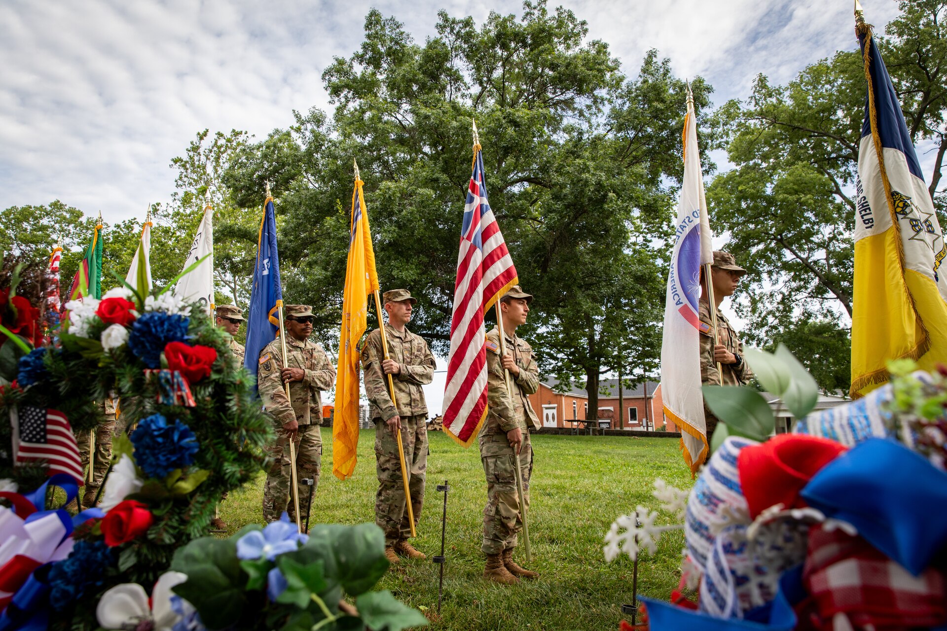 Kentucky Army National Guard Soldiers with the 103rd Brigade Support Battalion, 138th Field Artillery Brigade, prepare to post the colors for the 250th anniversary of the settlement of Harrodsburg at the Old Fort Harrod State Park in Harrodsburg, Kentucky on June 8, 2024. The 103rd BSB supported the 250th anniversary of the settlement of Harrodsburg by participating in posting the colors, marching in the parade, and providing a static display of military vehicles. (U.S. Army National Guard photo by Sgt. 1st Class Andrew Dickson)
