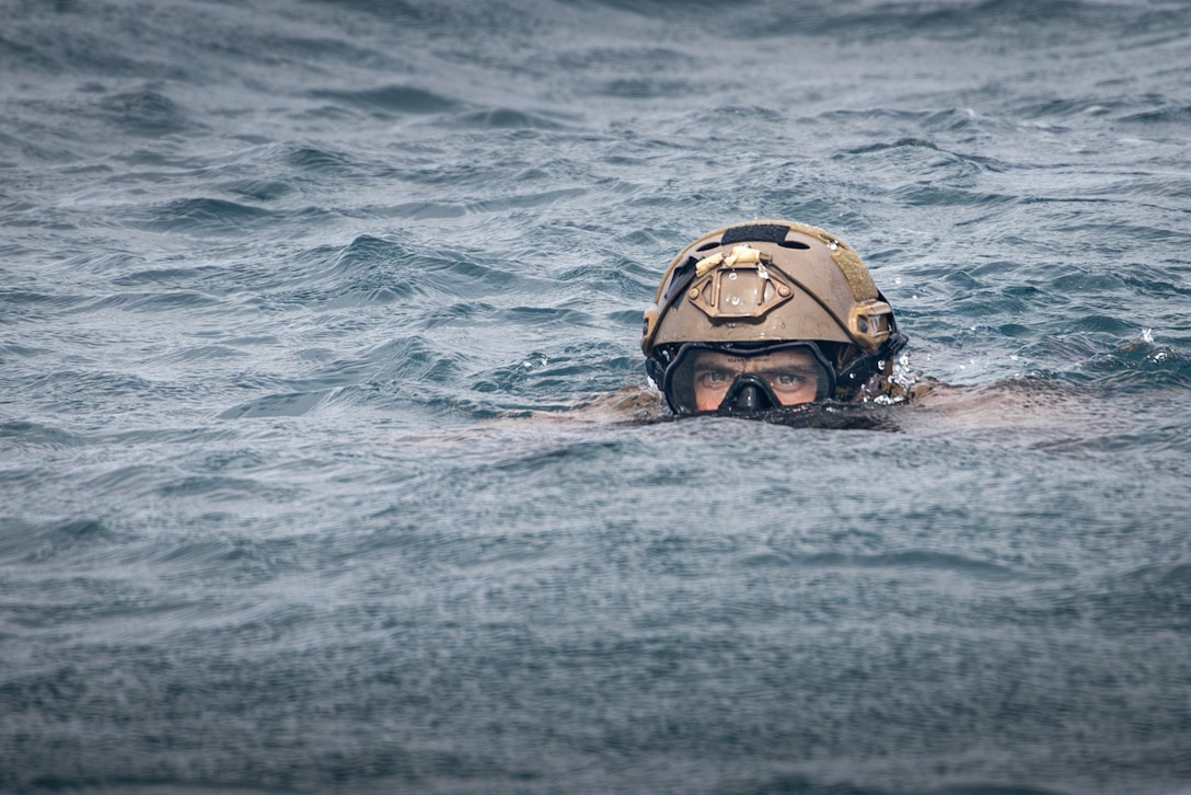 U.S. Marine Corps Staff Sgt. Lane Chirstman, a native of Indiana and a reconnaissance Marine with 2d Reconnaissance (Recon) Battalion, 2d Marine Division, conducts a tactical peek during Exercise Caribbean Coastal Warrior in Savaneta, Aruba, May 22, 2024. This bilateral training exercise with Dutch forces allowed 2d Recon to expand its knowledge and proficiency when operating in littoral and coastal regions. (U.S. Marine Corps photo Cpl. Joshua Kumakaw)