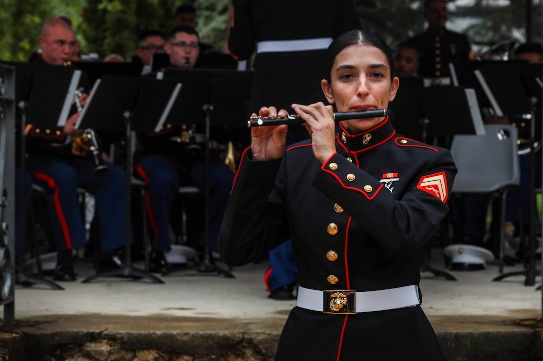 U.S. Marine Corps Cpl. Sonia Richman, a Shaker Heights, Ohio native, a flute instrumentalist and augment with the 2d Marine Division (MARDIV) band, plays the piccolo during a concert in Château-Thierry, France, May 23, 2024. The 2d MARDIV band, along with other Marine band members from around the world, supported various concerts and parades in multiple cities across France in preparation for the 2024 Belleau Wood Ceremony. (U.S. Marine Corps photo by Sgt. Alexa M. Hernandez)