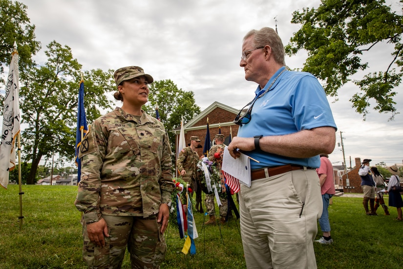 U.S. Army Lt. Col. Esther Platt, commander of the 103rd Brigade Support Battalion, talks with Harrodsburg Mayor Bob Williams at the 250th anniversary of the settlement of Harrodsburg, Kentucky on June 8, 2024. The 103rd BSB supported the 250th anniversary of the settlement of Harrodsburg by participating in posting the colors, marching in the parade, and providing a static display of military vehicles. (U.S. Army National Guard photo by Sgt. 1st Class Andrew Dickson)