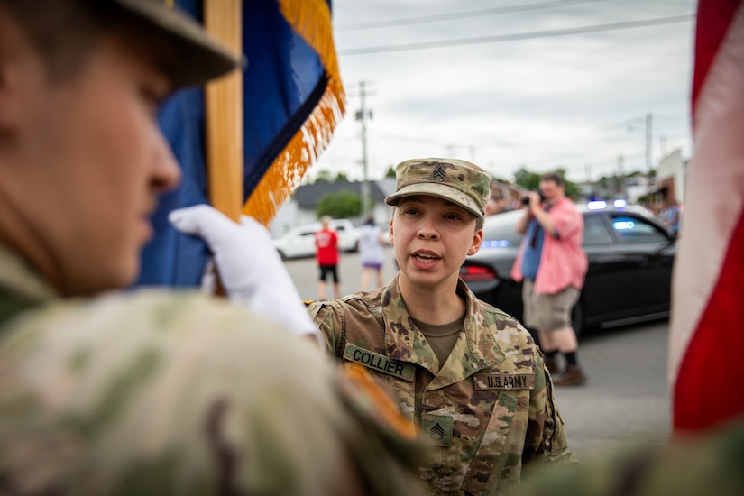 U.S. Army Staff Sgt. Mariah Colllier prepares the colorguard of the 103rd Brigade Support Battalion, 138th Field Artillery Brigade, for a parade in Harrodsburg, Kentucky on June 8, 2024. The 103rd BSB supported the 250th anniversary of the settlement of Harrodsburg by participating in posting the colors, marching in the parade, and providing a static display of military vehicles. (U.S. Army National Guard photo by Sgt. 1st Class Andrew Dickson)
