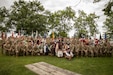 Soldiers with the 103rd Brigade Support Battalion, 138th Field Artillery Brigade, pose for a photo with the Sons of the American Revolution at the Old Fort Harrod State Park in Harrodsburg, Kentucky on June 8, 2024. The 103rd BSB supported the 250th anniversary of the settlement of Harrodsburg by participating in posting the colors, marching in the parade, and providing a static display of military vehicles. (U.S. Army National Guard photo by Sgt. 1st Class Andrew Dickson)