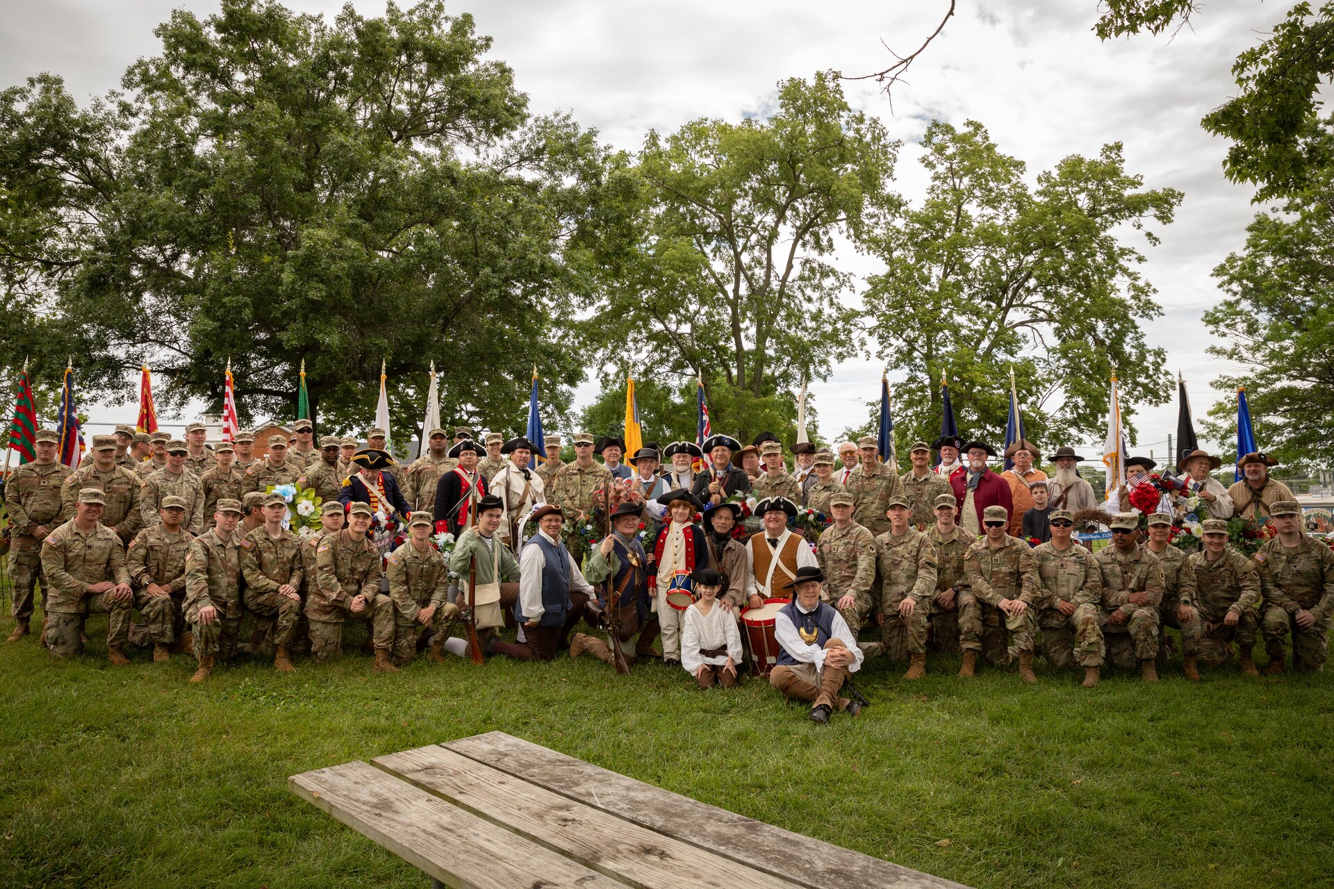 Soldiers with the 103rd Brigade Support Battalion, 138th Field Artillery Brigade, pose for a photo with the Sons of the American Revolution at the Old Fort Harrod State Park in Harrodsburg, Kentucky on June 8, 2024. The 103rd BSB supported the 250th anniversary of the settlement of Harrodsburg by participating in posting the colors, marching in the parade, and providing a static display of military vehicles. (U.S. Army National Guard photo by Sgt. 1st Class Andrew Dickson)