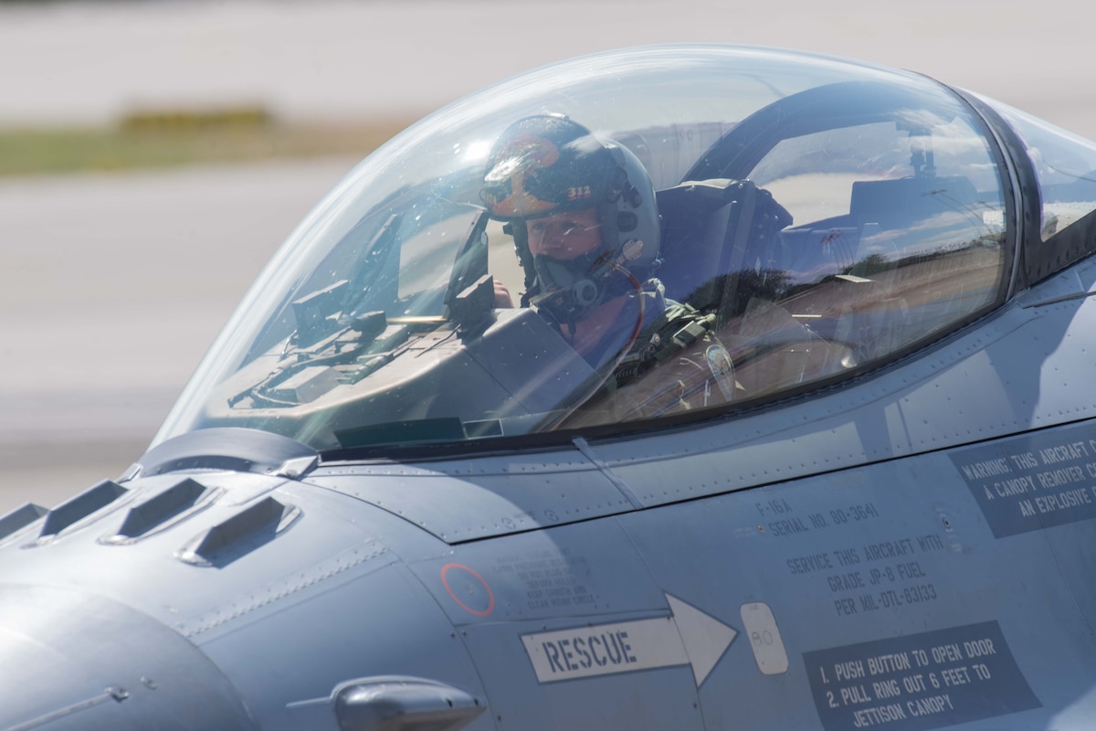 A U.S. Air Force F-16 Fighting Falcon pilot prepares to take off during Ramstein 1v1 at Ramstein Air Base, Germany, June 6, 2024. Ramstein 1v1, U.S. Air Forces in Europe - Air Forces Africa's first-ever basic fighter maneuvers exercise at Ramstein AB, included 37 fighter aircraft from nine NATO countries such as F-35A Lightning IIs; F-16 Fighting Falcons; Eurofighter Typhoons; Dassault Rafale Cs; F/A-18 Hornets and a Douglas A-4 Skyhawk. (U.S. Air Force photo by Airman 1st Class Trevor Calvert)