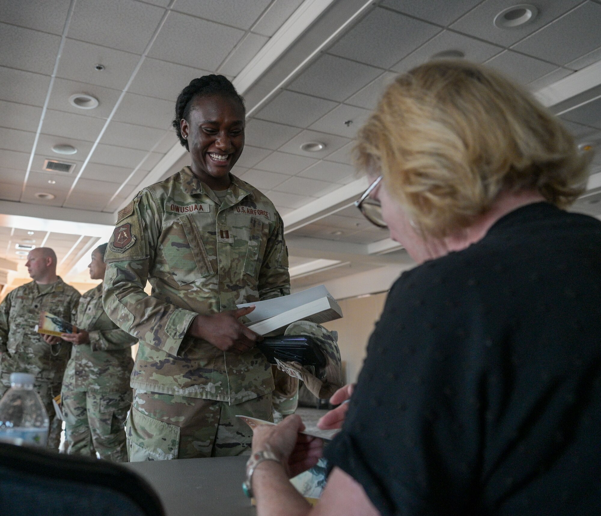 Airman gets a book signed by an author.