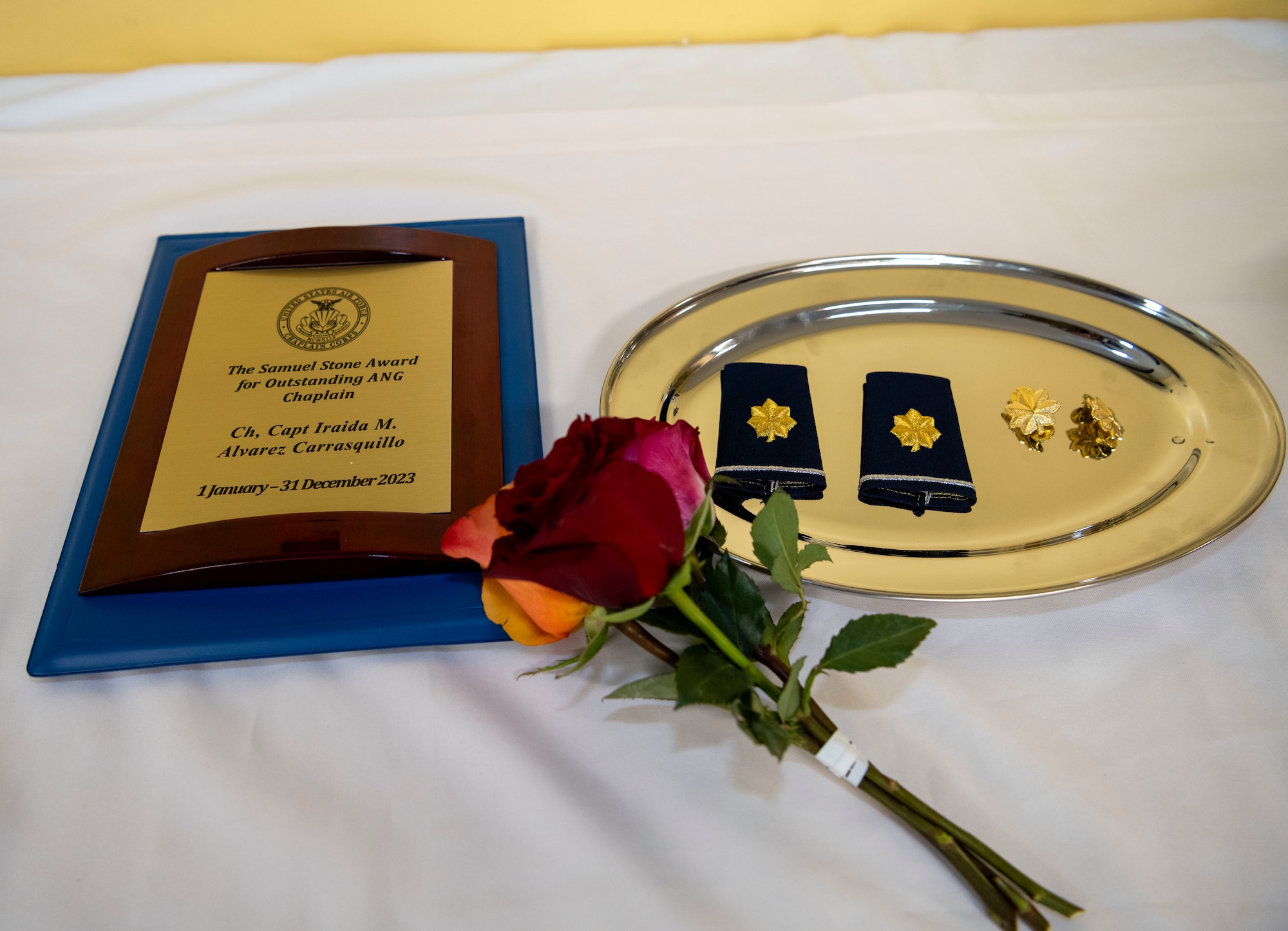 A detailed photo of the Samuel Stone Award and the oak leaf insignia for the rank of major during a ceremony for U.S. Air Force Capt. Iraida M. Alvarez Carrasquillo, the 156th Wing chaplain, Puerto Rico Air National Guard, at Muñiz Air National Guard Base, Carolina, Puerto Rico, June 1, 2024. During the ceremony, Alvarez received the Samuel Stone Award, recognizing her as the outstanding Air National Guard Chaplain of the Year. (U.S. Air National Guard photo by Airman 1st Class Marrissa L. Rodriguez)