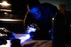 U.S. Air Force Senior Airman Jonathan Macias, 5th Maintenance Squadron non-destructive inspection (NDI) journeyman, conducts a magnetic particle inspection on a MHU-97/E part at Minot Air Force Base, North Dakota, June 6, 2024. NDI has a variety of inspection methods, to include fluorescent penetrant, magnetic particles, x-ray, ultrasound, oil analysis and eddy current. (U.S. Air Force photo by Airman 1st Class Luis Gomez)