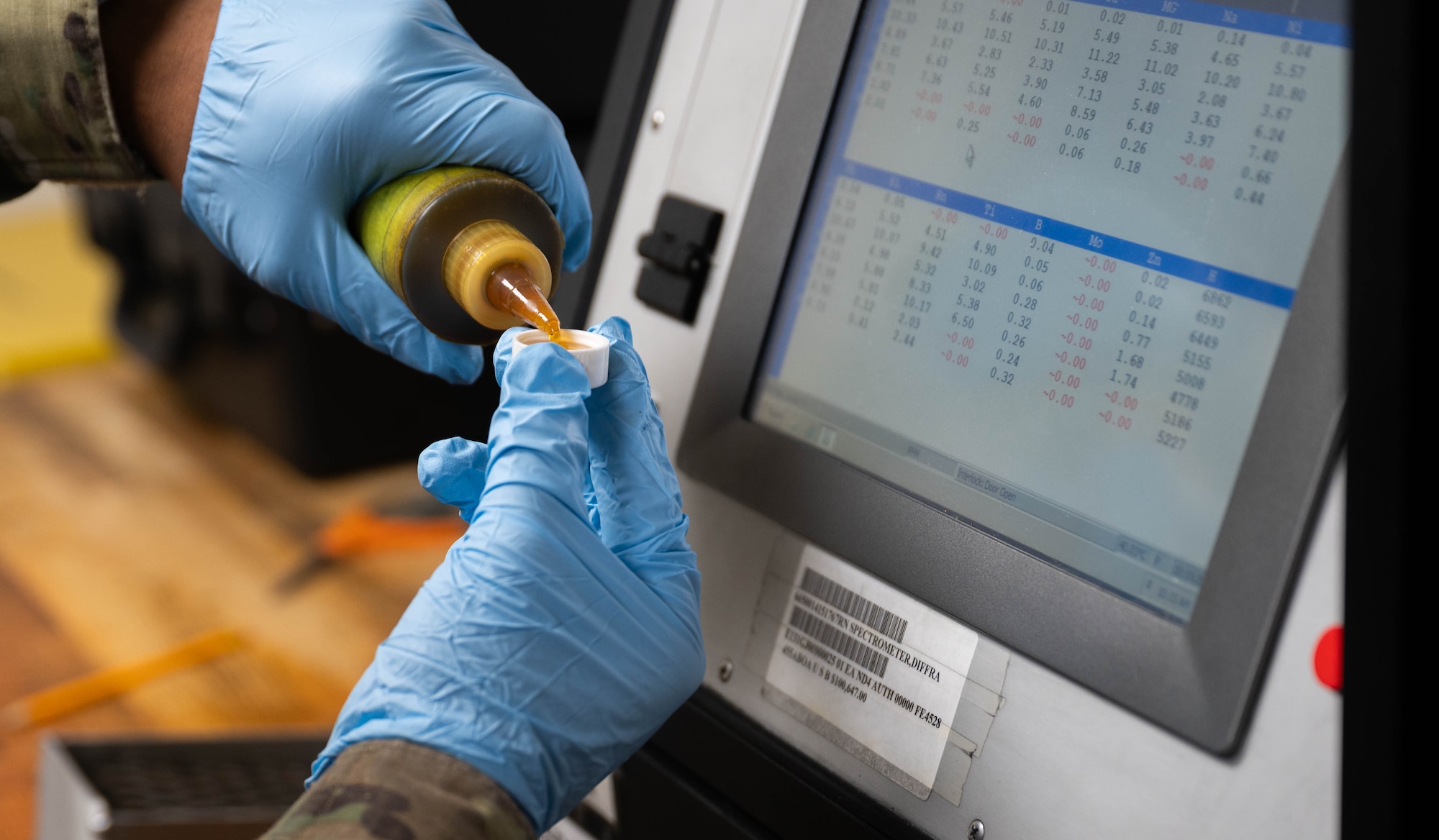 U.S. Air Force Airman 1st Class Omar Murphy, 5th Maintenance Squadron non-destructive inspection (NDI) apprentice, demonstrates an oil analysis at Minot Air Force Base, North Dakota, June 6, 2024. NDI has a variety of inspection methods, to include fluorescent penetrant, magnetic particles, x-ray, ultrasound, oil analysis and eddy current. (U.S. Air Force photo by Airman 1st Class Luis Gomez)