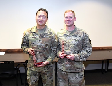 Master Sgt. Peung Kim and Chief Warrant Officer 3 David Turner are pictured after receiving the 2024 Dean R. Ohlsen Award of Excellence during a ceremony May 21 at Fort Detrick, Maryland. The annual award is given to a warrant officer, enlisted Soldier and Army Civilian. Not pictured is the civilian winner, Thuy Dao. (C.J. Lovelace)