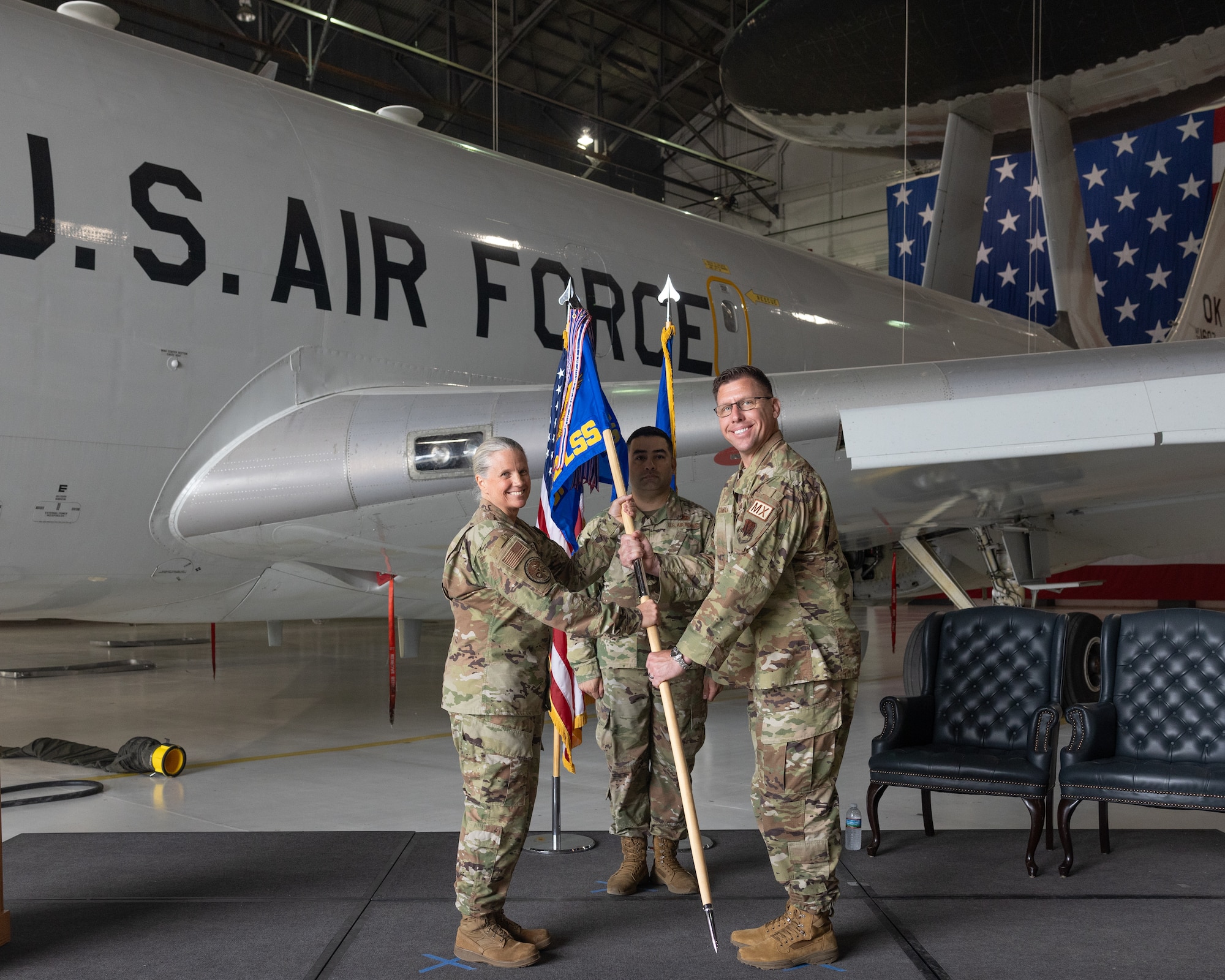 Man and woman holding flag