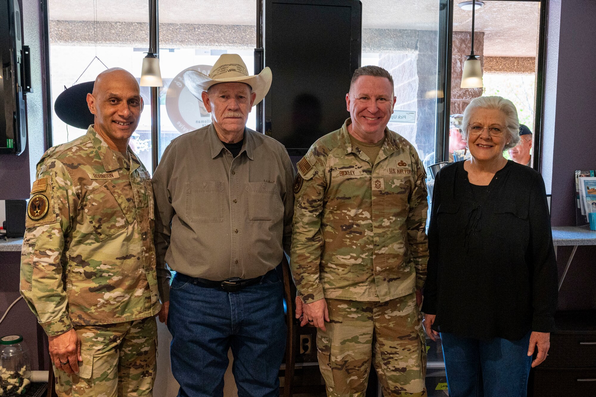 U.S. Air Force Lt. Gen. Brian Robinson, commander of Air Education and Training Command, left, and U.S. Air Force Chief Master Sgt. Chad Bickley, AETC command chief, center right, poses for a photo with members of the Refuel Cafe team during a visit at Holloman Air Force Base, New Mexico, June 4, 2024. The visit gave Robinson and Bickley an opportunity to hear from Airmen about what areas AETC leadership can better assist the mission and quality of life for all members of the First Command. (U.S Air Force photo by Senior Airman Isaiah Pedrazzini)