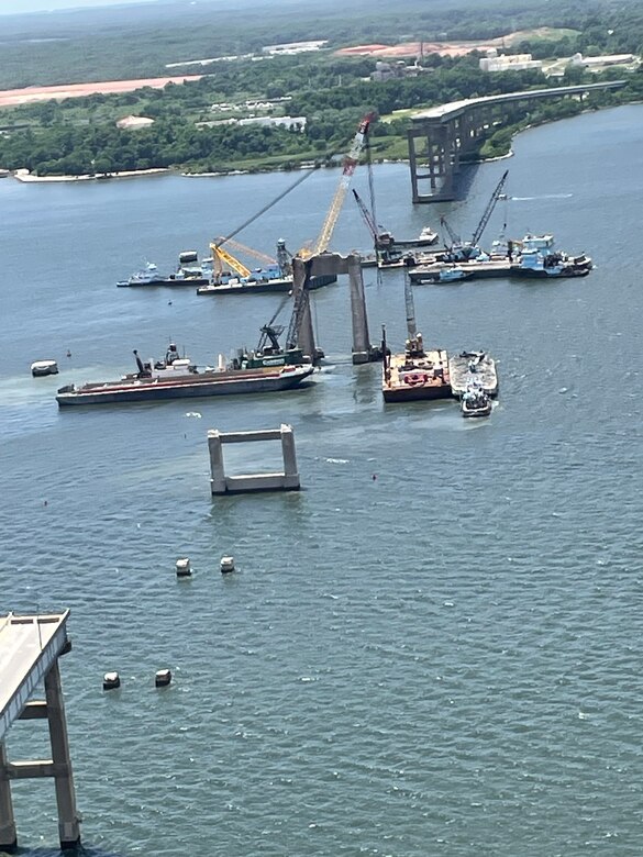 Unified Command’s ongoing salvage work in the Fort McHenry Federal Channel nears its conclusion, as shown in these aerial photos taken Friday afternoon, June 7, 2024. Courtesy of Maryland State Police Aviation Command, salvors continue pulling massive, mangled chunks of Francis Scott Key Bridge wreckage from the watery depths of the Patapsco River.
