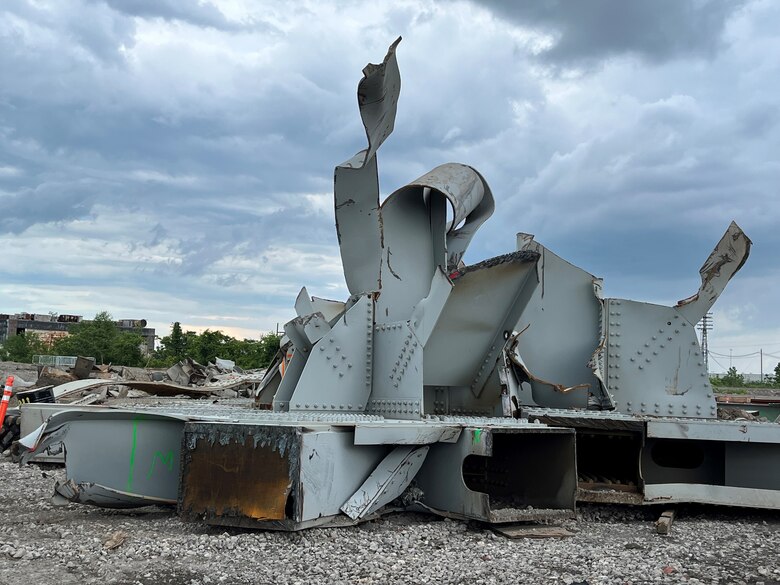 Armed with oxyacetylene torches and a 75-ton claw excavator Wednesday afternoon, June 5, 2024, at Sparrows Point, MD, Unified Command salvage workers quickly carve up “Segment 4C” – a 420-ton section of steel truss removed from the Fort McHenry Federal Channel the day prior. Once cut into smaller pieces, crews load the Francis Scott Key Bridge steel onto tractor trailers for offsite recycling. (U.S. Army photo by Bobby Petty)