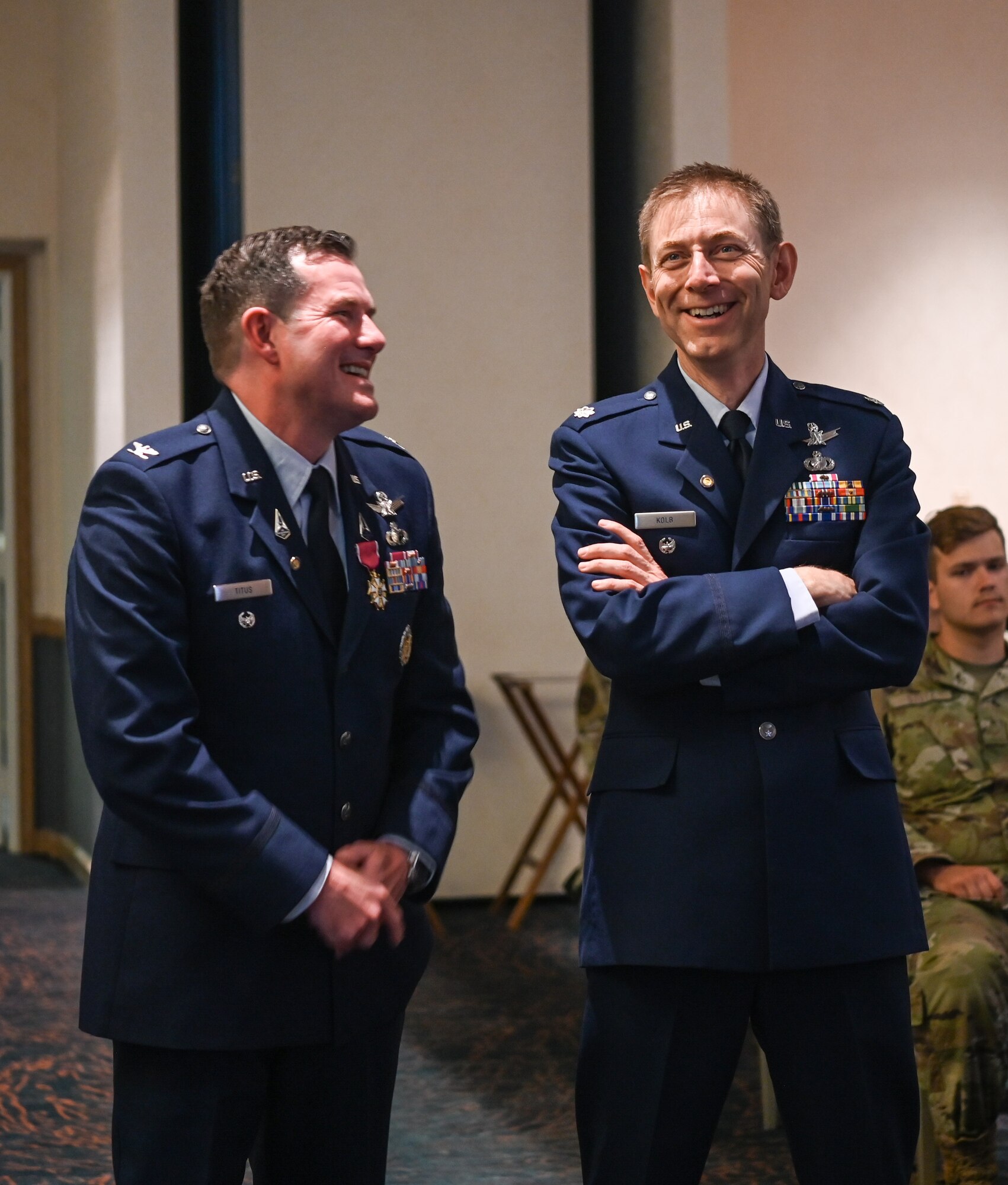 A Space Launch Delta 30 operations vice commander (left) and Eric Kolb, long time friend, reflects on life towards the end of the retirement ceremony at Vandenberg Space Force Base.