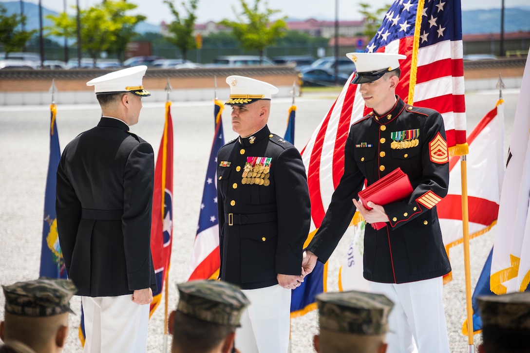 U.S. Marines with U.S. Marine Corps Forces, Korea prepare to present a Meritorious Service Medal during a retirement ceremony on U.S. Army Garrison Humphreys, South Korea, May 28, 2024. MARFORK is the U.S. Marine Corps service component for United States Forces Korea and United Nations Command. MARFORK commands all U.S. Marine Forces assigned to USFK and UNC; as well as advises on the Marine Corps capabilities, support and proper employment of Marine Forces. (U.S. Marine Corps photo by Cpl. Dean Gurule)