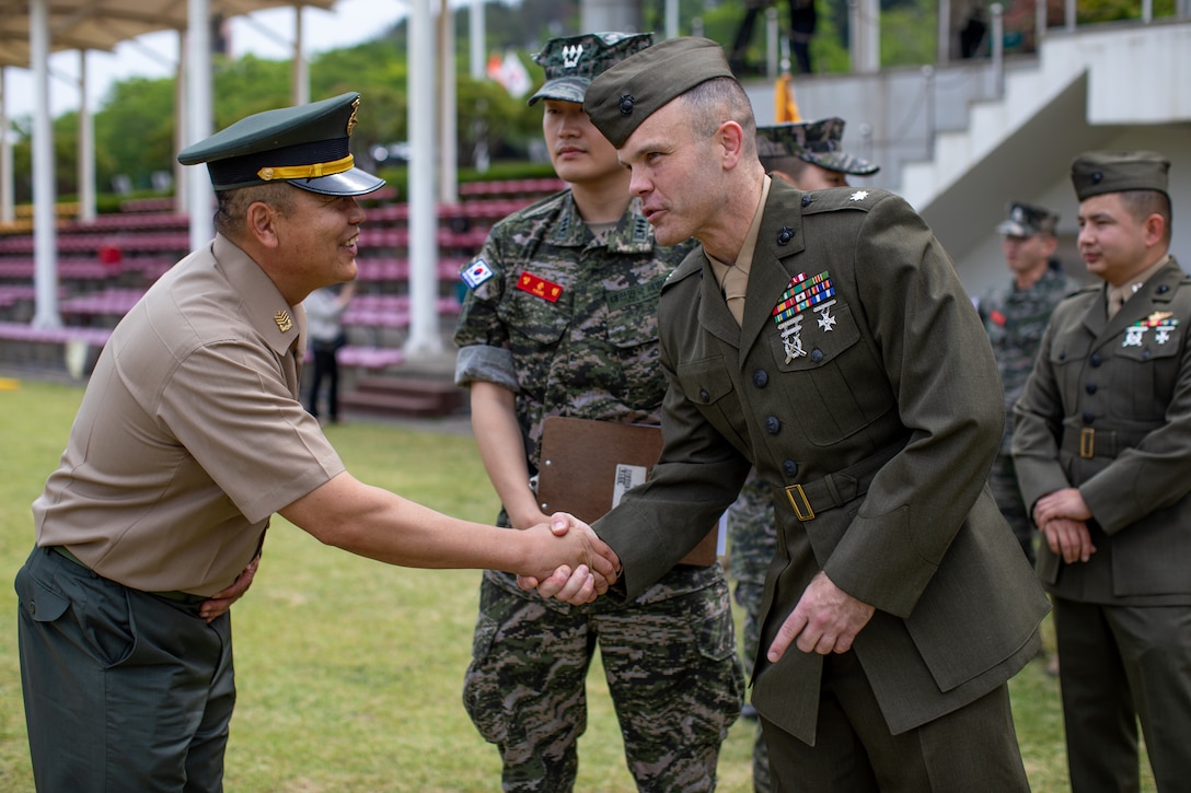 U.S. Marine Corps Lt. Col. Willis Staton, right, an assistant chief of staff for U.S. Marine Corps Forces Korea, greets a Republic of Korea Marine during a Republic of Korea Marine Corps bootcamp graduation in Pohang, South Korea, May 30, 2024. MARFORK is the U.S. Marine Corps service component for United States Forces Korea and United Nations Command. MARFORK commands all U.S. Marine Forces assigned to USFK and UNC; as well as advises on the Marine Corps capabilities, support and proper employment of Marine Forces. (U.S. Marine Corps photo by Cpl. Dean Gurule)