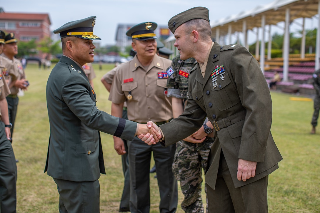 U.S. Marine Corps Lt. Col. Willis Staton, right, an assistant chief of staff for U.S. Marine Corps Forces Korea, greets a Republic of Korea Marine during a Republic of Korea Marine Corps bootcamp graduation in Pohang, South Korea, May 30, 2024. MARFORK is the U.S. Marine Corps service component for United States Forces Korea and United Nations Command. MARFORK commands all U.S. Marine Forces assigned to USFK and UNC; as well as advises on the Marine Corps capabilities, support and proper employment of Marine Forces. (U.S. Marine Corps photo by Cpl. Dean Gurule)