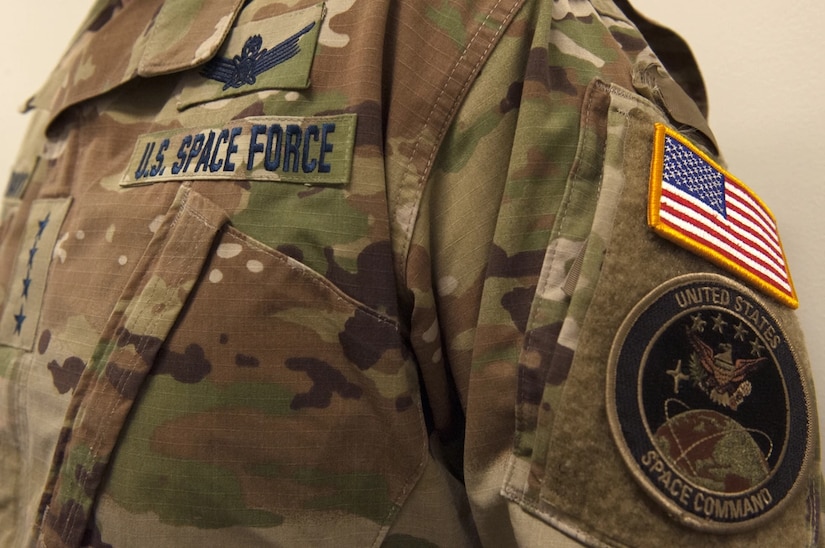 A guardian's uniform is seen with the U.S. Space Force,  American flag and unit patch visible.