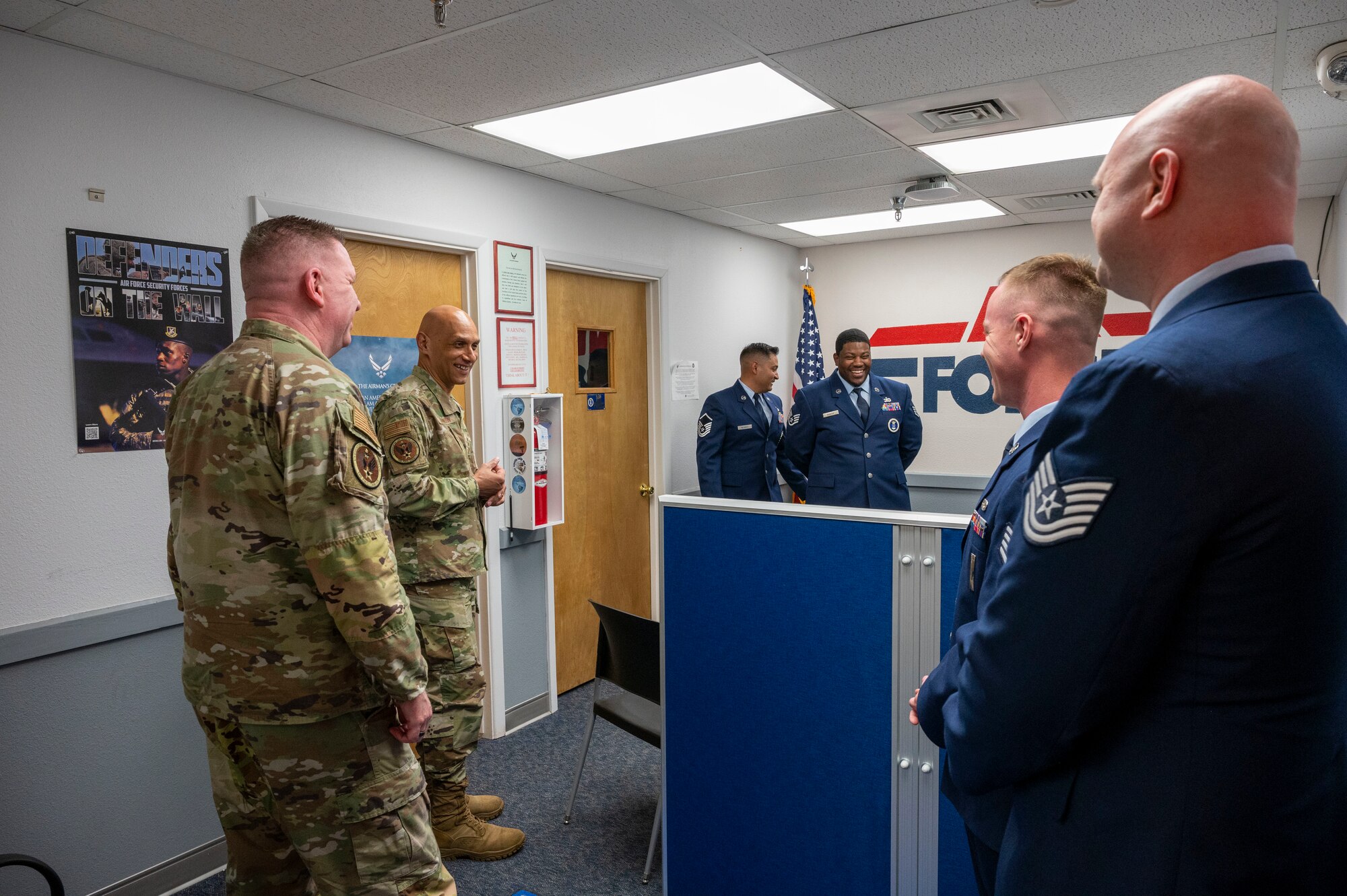 U.S. Air Force Lt. Gen. Brian Robinson, commander of Air Education and Training Command, center left, and U.S. Air Force Chief Master Sgt. Chad Bickley, AETC command chief, left, meet with Air Force recruiters at the White Sands Mall at Alamogordo New Mexico, June 4, 2024. The purpose of the visit was for Robinson and Bickley to engage with Airmen and personnel on the installation and to present the prestigious Altus Trophy to the Alamogordo community. (U.S Air Force photo by Senior Airman Isaiah Pedrazzini)