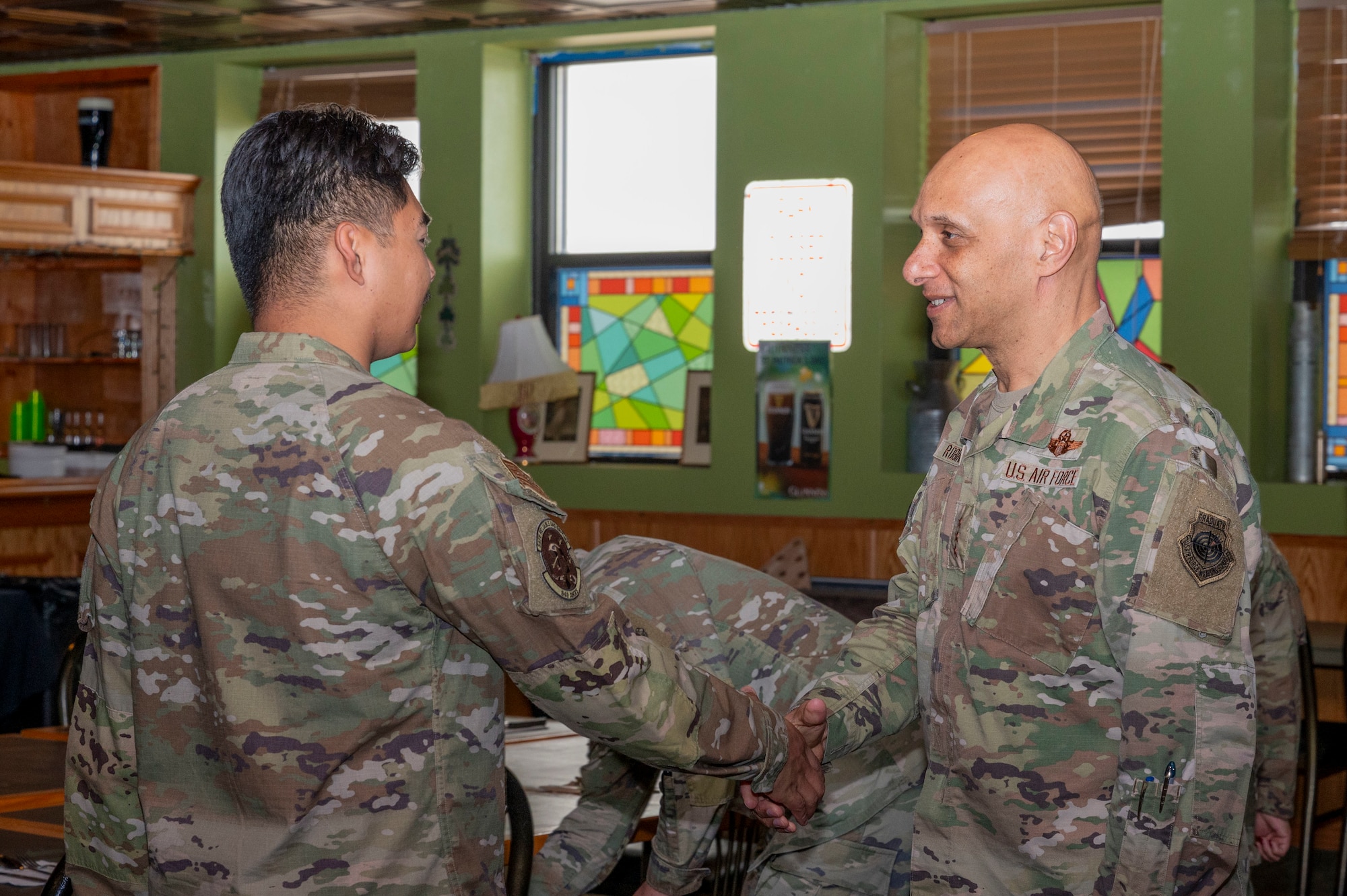 U.S. Air Force Lt. Gen. Brian Robinson, commander of Air Education and Training Command, right, greets an Airman from the Joel C. Mayo Airman Leadership School class 24-E during a visit at Holloman Air Force Base, New Mexico, June 4, 2024. The visit gave Robinson and Bickley an opportunity to hear from Airmen about what areas AETC leadership can better assist the mission and quality of life for all members of the First Command. (U.S Air Force photo by Senior Airman Isaiah Pedrazzini)
