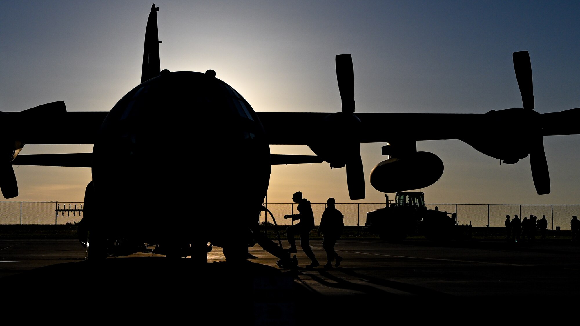 U.S. Airmen assigned to the 910th Aircraft Maintenance Squadron board a 910th Airlift Wing aerial spray-modified C-130H Hercules aircraft, on May 29, 2024, to conduct preflight checks at Williston Basin International Airport, North Dakota.