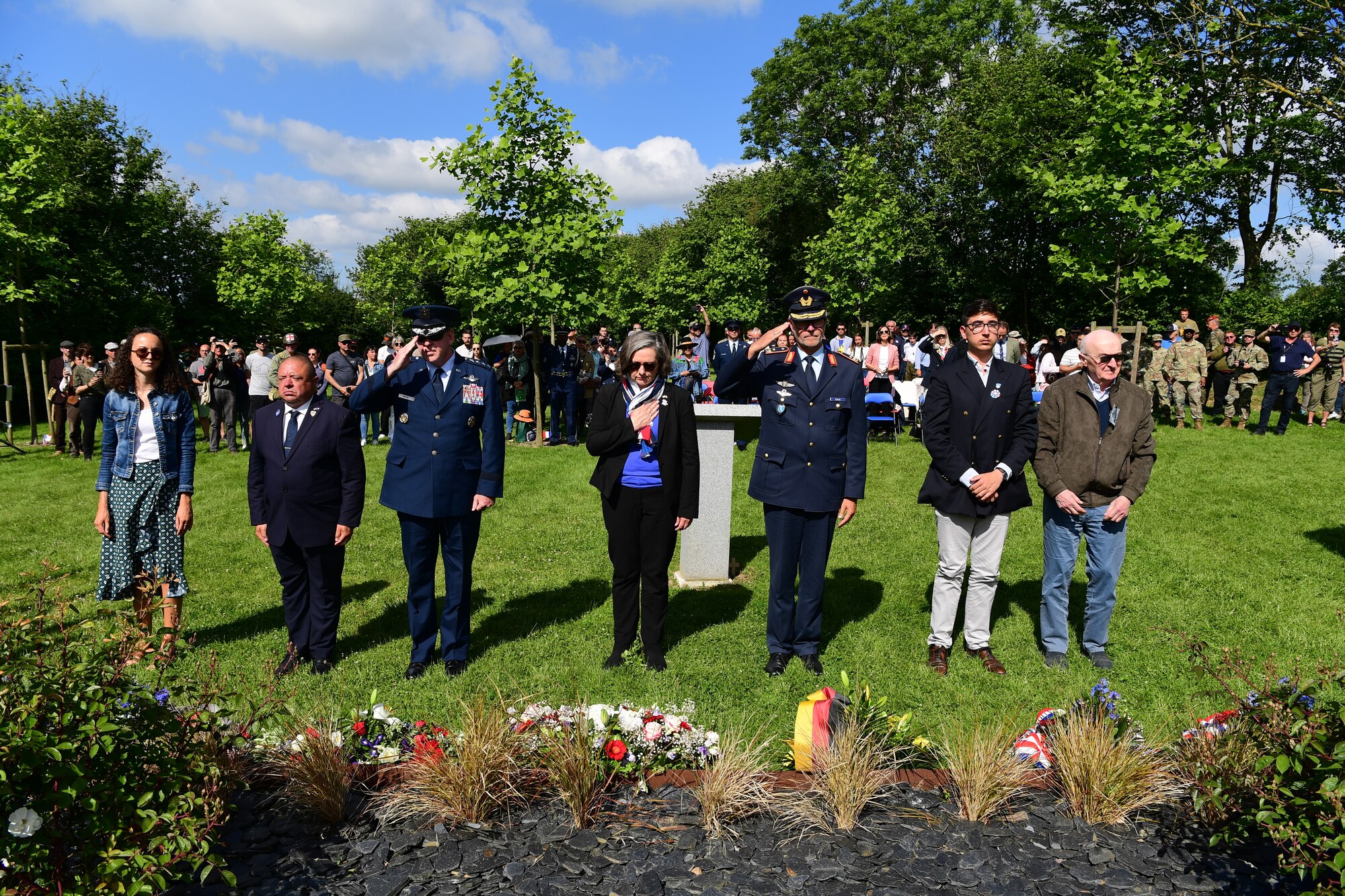 Gen. James B. Hecker, commander of U.S. Air Forces in Europe - Air Forces Africa, salutes after laying a wreath during a C-47 Memorial Garden Ceremony in Picauville, France, June 7, 2024. The memorial garden is decorated with 20 tulip trees and an outline of a C-47 to honor the lives of the service members lost 80 years ago. (U.S. Air Force photo by Senior Airman Noah Sudolcan)