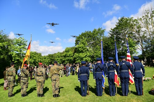 A formation of C-130J’s perform a flyover during a C-47 Memorial Garden Ceremony in Picauville, France, June 7, 2024. The ceremony honored the lives of the lost service members on June 6th 1944. (U.S. Air Force photo by Senior Airman Noah Sudolcan)
