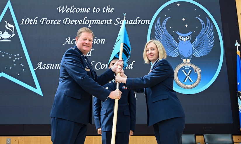 U.S. Space Force Lt. Col. Amber Dawson assumes command of the 10th Force Development Squadron during an activation and assumption of command ceremony at the U.S. Air Force Academy, in Colorado Springs, Colo., June 6, 2024. The 10th FDS is one of four units that constitute Delta 10, and focuses on providing warfighters with the necessary doctrine to conduct the “fight tonight.” The 10th FDS not only produces Space Force doctrine, but it also codifies service tactics and plays a pivotal role in Space Force concept development to posture Space Force forces and designated joint and allied partners to prevail in a Contested, Degraded, Operationally Limited (CDO), all-domain environment. (U.S. Air Force photo by Capt. Charles Rivezzo)