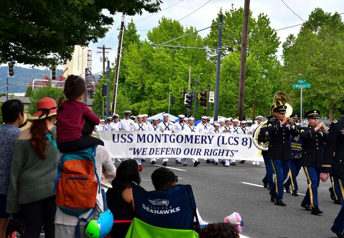 Sailors assigned to the Independence-variant littoral combat ship USS Montgomery (LCS 8) march in the Grand Floral Parade during the annual Portland Fleet Week and Rose Festival in Portland, Oregon.