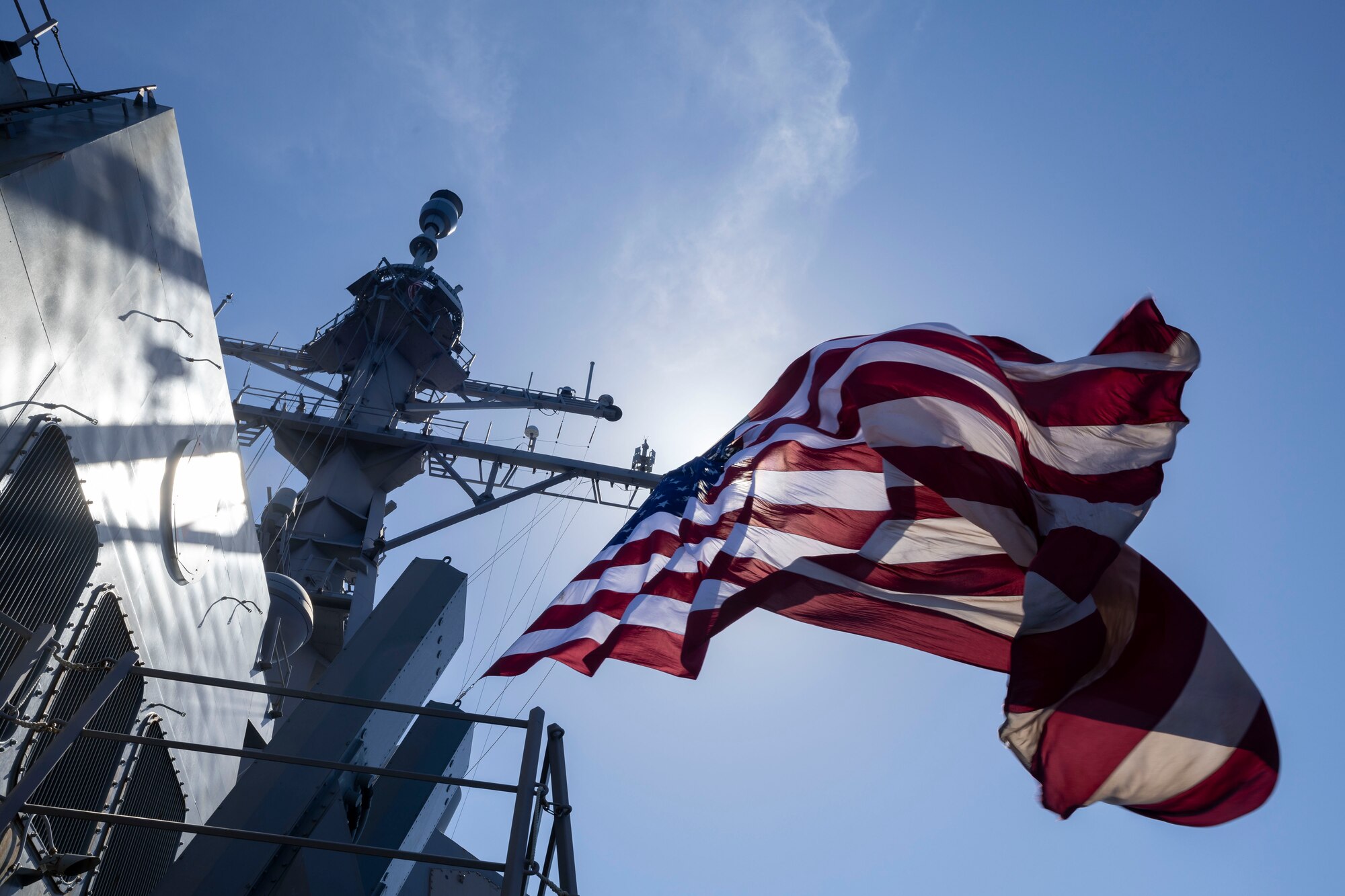 The Arleigh Burke-class guided-missile destroyer USS Rafael Peralta (DDG 115) flies the Battle Ensign while maneuvering alongside U.S. and Japan Maritime Self-Defense Force ships in support of Valiant Shield 2024 in the Philippine Sea, June 7, 2024.