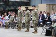 The commander of the 405th Army Field Support Brigade, Col. Ernest Lane II, stands in the center between Lt. Col. Blake Smith and Lt. Col. George, at their change of command ceremony. Smith relinquished command of Army Field Support Battalion-Benelux to Horne during the ceremony June 10 at the Eygelshoven Army Prepositioned Stocks-2 worksite in the Netherlands. (photo by Rob Vankan, Dutch Ministry of Defense)