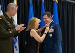 Dianne Loh, center, pins a retirement lapel on U.S. Air Force Lt. Gen. Michael A. Loh, right, director, Air National Guard, during Loh’s retirement ceremony at Wings Over the Rockies Air & Space Museum, Denver, Colorado, June 9, 2024. As the 13th director of the ANG, Loh was responsible for overseeing policies, plans and programs affecting more than 108,400 ANG Airmen and civilians across 90 wings through the 54 states, territories and the District of Columbia.