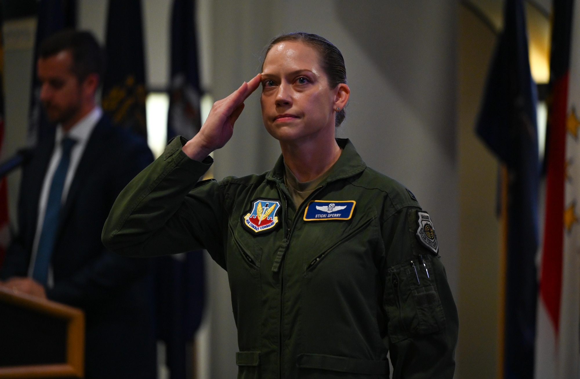 U.S. Air Force Col. Candice Sperry, 350th Spectrum Warfare Group commander, renders her first salute to members of the 350th SWG during a change of command ceremony at the U.S. Armament Museum, Eglin Air Force Base, Florida, June 7, 2024. The 350th SWG continuously tests and improves the U.S. Air Force's rapid reprogramming capabilities to ensure the Combat Air Force is ready for near-peer threats. (U.S. Air Force photo by Capt. Benjamin Aronson)