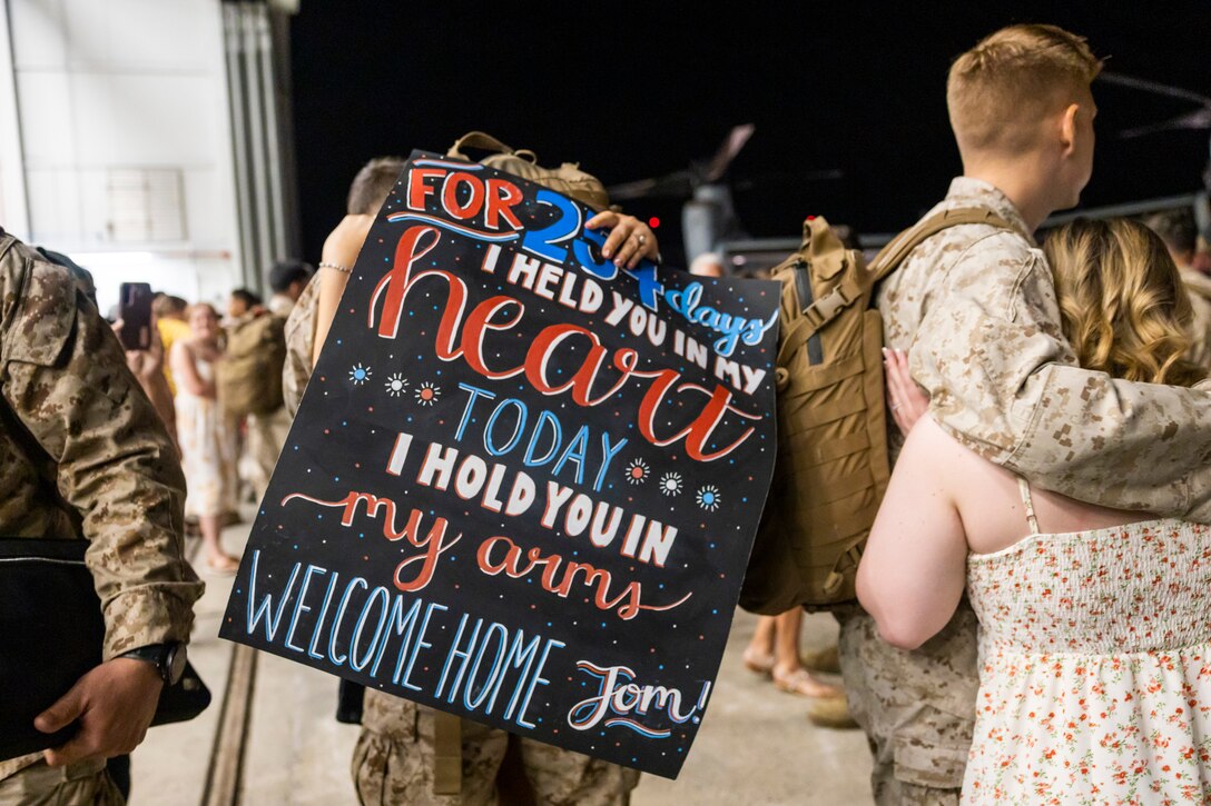U.S. Marines and Sailors of Marine Medium Tiltrotor Squadron (VMM) 261 embrace their loved ones at Marine Corps Air Station New River, North Carolina, June 3, 2024. VMM-261 returned home from a 9-month deployment in support of Combined Joint Task Force - Horn of Africa. (U.S. Marine Corps photo by Sgt. Christopher Hernandez)