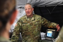 Maj. David C. Jennings discusses medical equipment readiness with Soldiers assigned to the 75th Field Hospital in Baumholder, Germany, who are participating in DEFENDER 24, a large-scale exercise in Europe that focuses on the strategic deployment of continental, U.S.-based forces, employment of Army Prepositioned Stocks, and interoperability with Allies and partners at exercise locations across 13 European countries. (Ellen Crown)