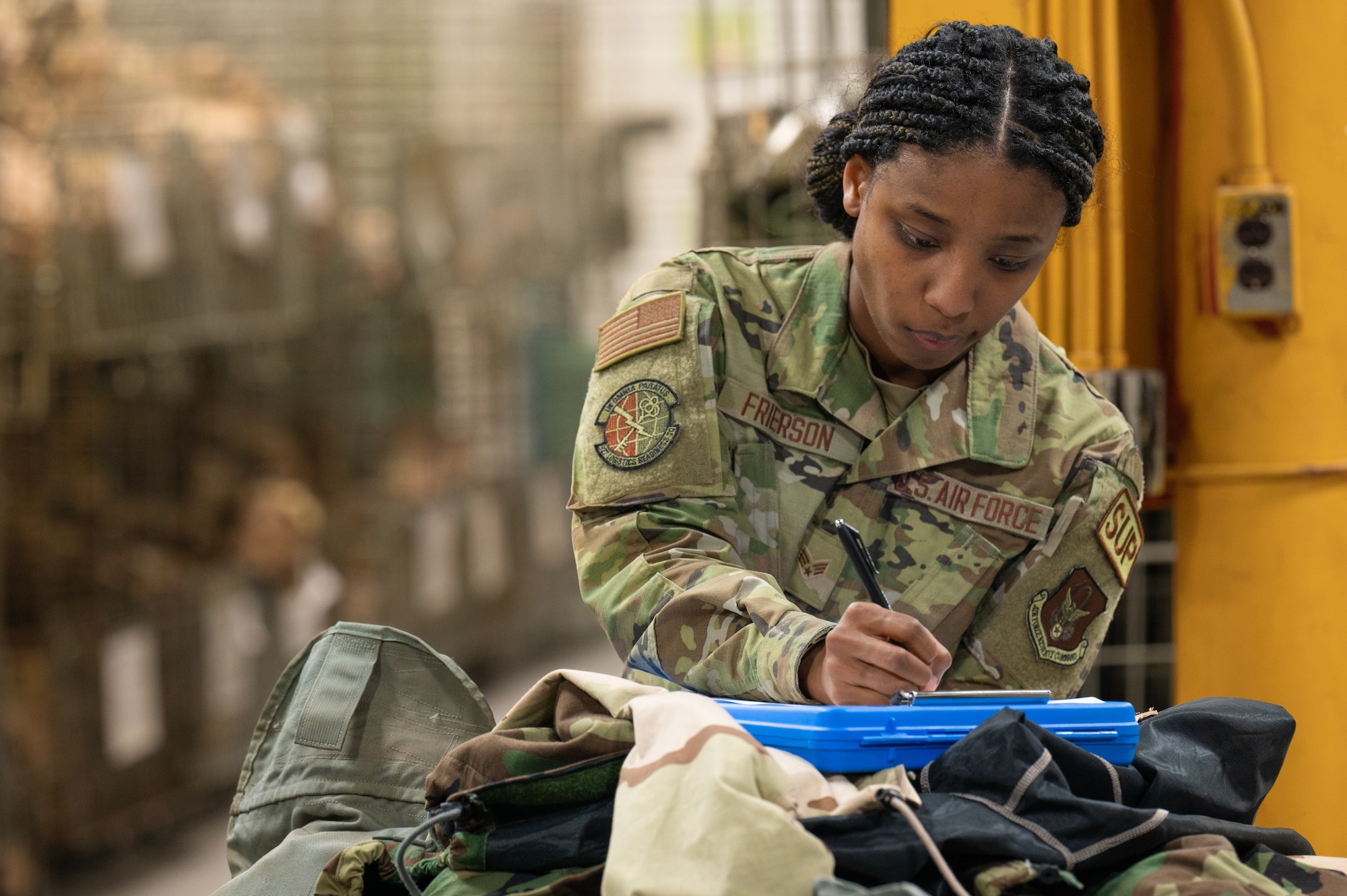 Senior Airman Heavenly Frierson, 927th Logistics Readiness Squadron aircraft parts store journeyman completes forms during equipment issue on the Super Unit Training Assembly held on MacDill AFB, Florida, June 1-4, 2024. This training prepared members to utilize their skills while under pressure to ensure they are mission ready. (U.S. Air Force Photo by Tech. Sgt. Bradley Tipton)