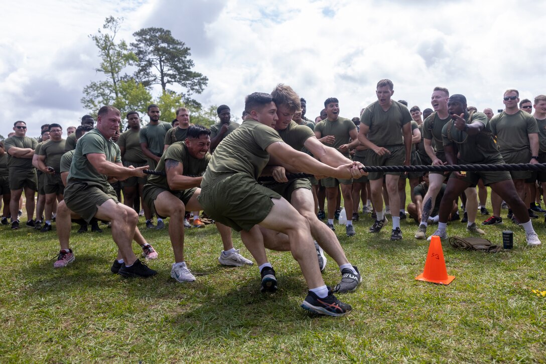 U.S. Marines with Combat Logistics Regiment 2, 2nd Marine Logistics Group, compete in a tug-of-war competition during the CLR-2 field meet on Camp Lejeune, North Carolina, June 6, 2024. CLR-2 Marines and Sailors participated in a field meet with various athletic events, promoting cohesion, camaraderie, and physical fitness within the unit. (U.S. Marine Corps photo by Lance Cpl. Jessica J. Mazzamuto)