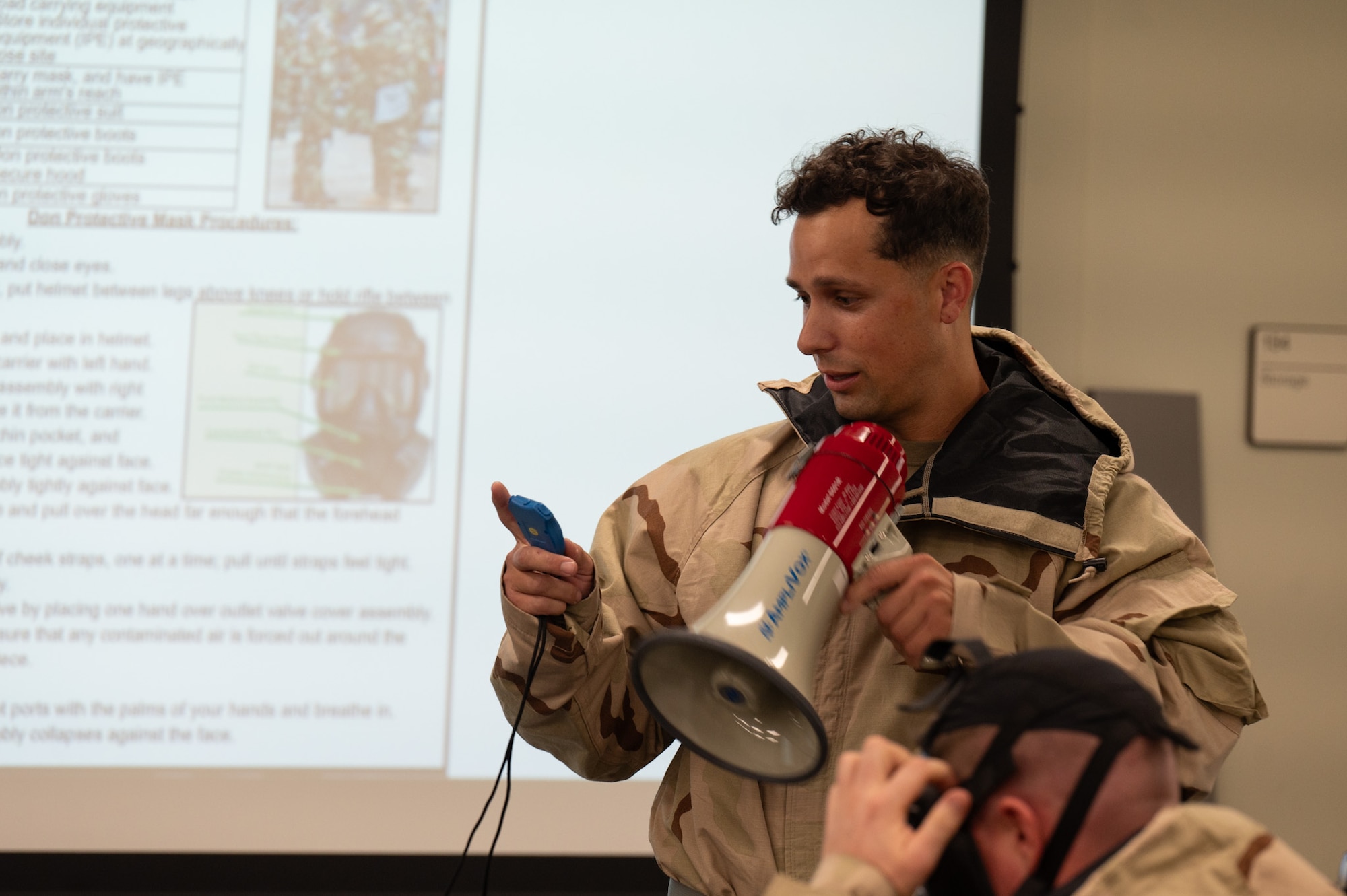 Air Force Master Sgt. Daniel Kelley, 927th Air Refueling Wing Inspection Coordinator, prepares to time Airmen as they don Mission Oriented Protective Posture gear during the Super Unit Training Assembly held on MacDill AFB, June 1-4, 2024. This training prepared members to utilize their skills while under pressure to ensure they are mission ready. (U.S. Air Force Photo by Tech. Sgt. Bradley Tipton)