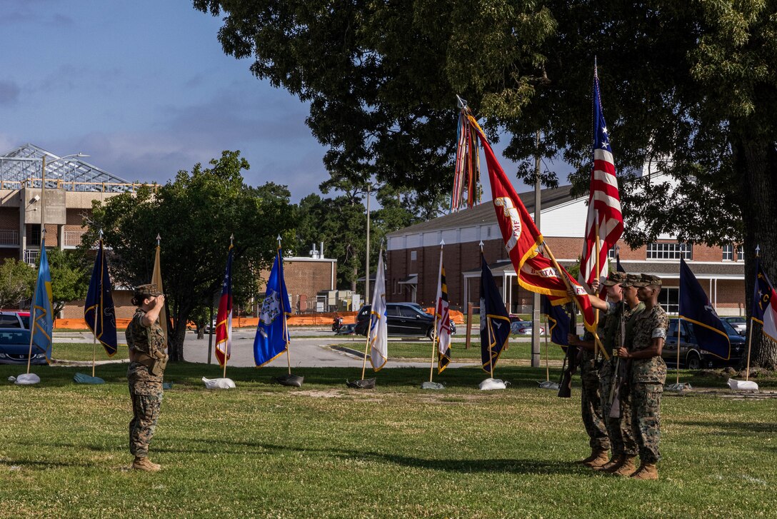U.S. Marine Corps 1st Lt. Shanna Unger, left, the battalion adjutant of 2d Light Armored Reconnaissance (LAR) Battalion, 2d Marine Division (MARDIV), salutes the colors during a change of command ceremony on Camp Lejeune, North Carolina, June 6, 2024. During the ceremony, U.S. Marine Corps Lt. Col. Charles E. Miller II, the outgoing commanding officer for 2d LAR, 2d MARDIV, relinquished command to Lt. Col. Michael W. Kohler, the incoming commanding officer for 2d LAR, 2d MARDIV. (U.S. Marine Corps photo by Cpl. Noelia Vazquez)