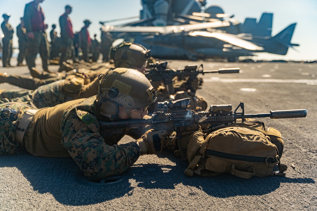 U.S. Marines and Sailors with Alpha Company, Battalion Landing Team 1/8, 24th Marine Expeditionary Unit (MEU) Special Operations Capable (SOC), conduct a live-fire weapons familiarization drill aboard the amphibious assault ship USS Wasp (LHD 1) while underway in the Atlantic Ocean, June 8, 2024. The Wasp Amphibious Ready Group-24th MEU (SOC) is conducting operations in U.S. Naval Forces Europe area of operations to support high-end warfighting exercises while demonstrating speed and agility operating in a dynamic security environment. (U.S. Marine Corps photo by Cpl. Elton Taylor)