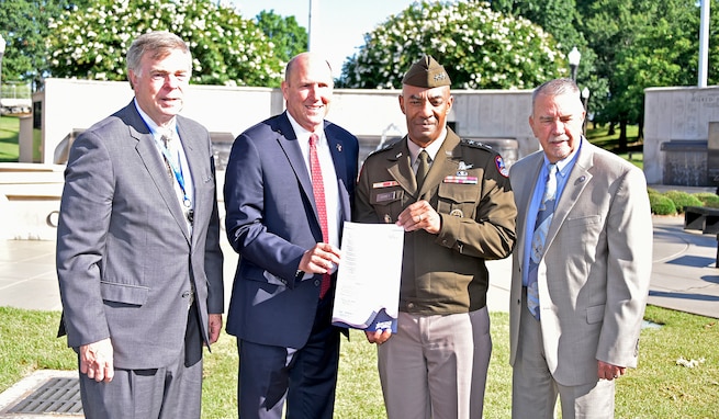 Lt. Gen. Sean A. Gainey, commanding general, U.S. Army Space and Missile Defense Command, accepts an Armed Forces Celebration Week proclamation signed by leaders from across the Tennessee Valley, from left, Huntsville Mayor Tommy Battle, Madison City Mayor Paul Finley and Madison County Commission Chairman Mac McCutcheon. The proclamation signing ceremony was on June 10 at Veterans Memorial Park in Huntsville. (U.S. Army photo by Jason Cutshaw)
