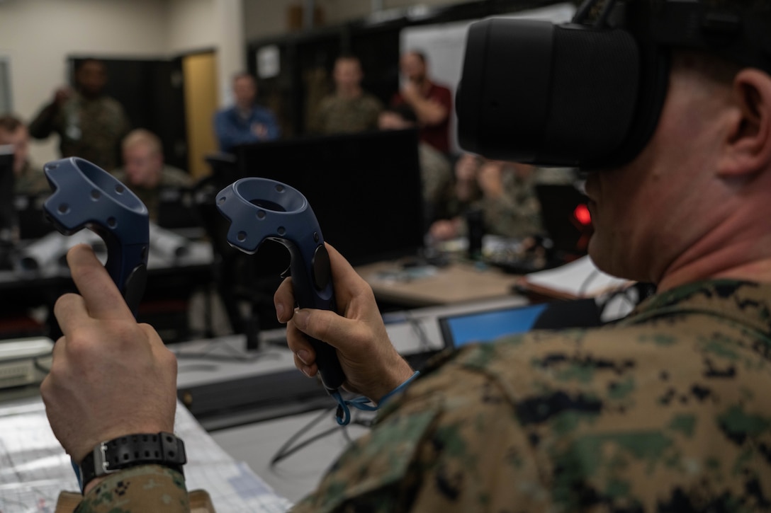 U.S. Marine Corps Sgt. Mason Whatley, a radio operator with 1st Air Naval Gunfire Liaison Company, I Marine Expeditionary Force Information Group, uses a Varjo XR-3 mixed reality headset during 1st ANGLICO certification exercise 2-23 at Marine Corps Base Camp Pendleton, California, Jan. 11, 2023. The first week of CERTEX 2-23 covers immersive simulation training in order to certify firepower control teams for future integration with other units. (U.S. Marine Corps photo by Lance Cpl. Joseph Helms)